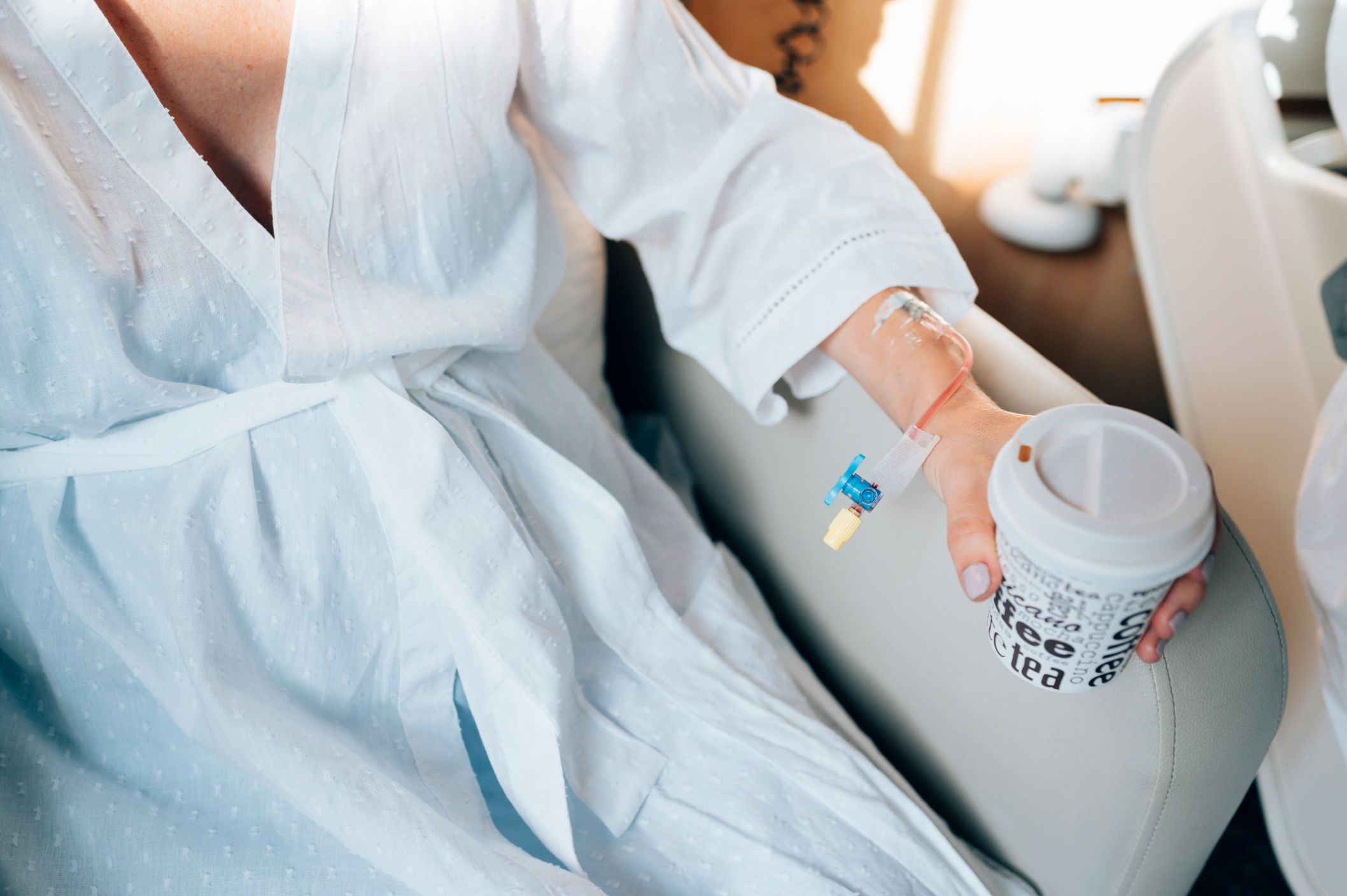 Travel Smart, Stay Hydrated: Where to Get an IV For Hydration After Your Next Trip 1 hand of the woman with coffee in the hospital 2026 03 19 04 22 36 utc 1