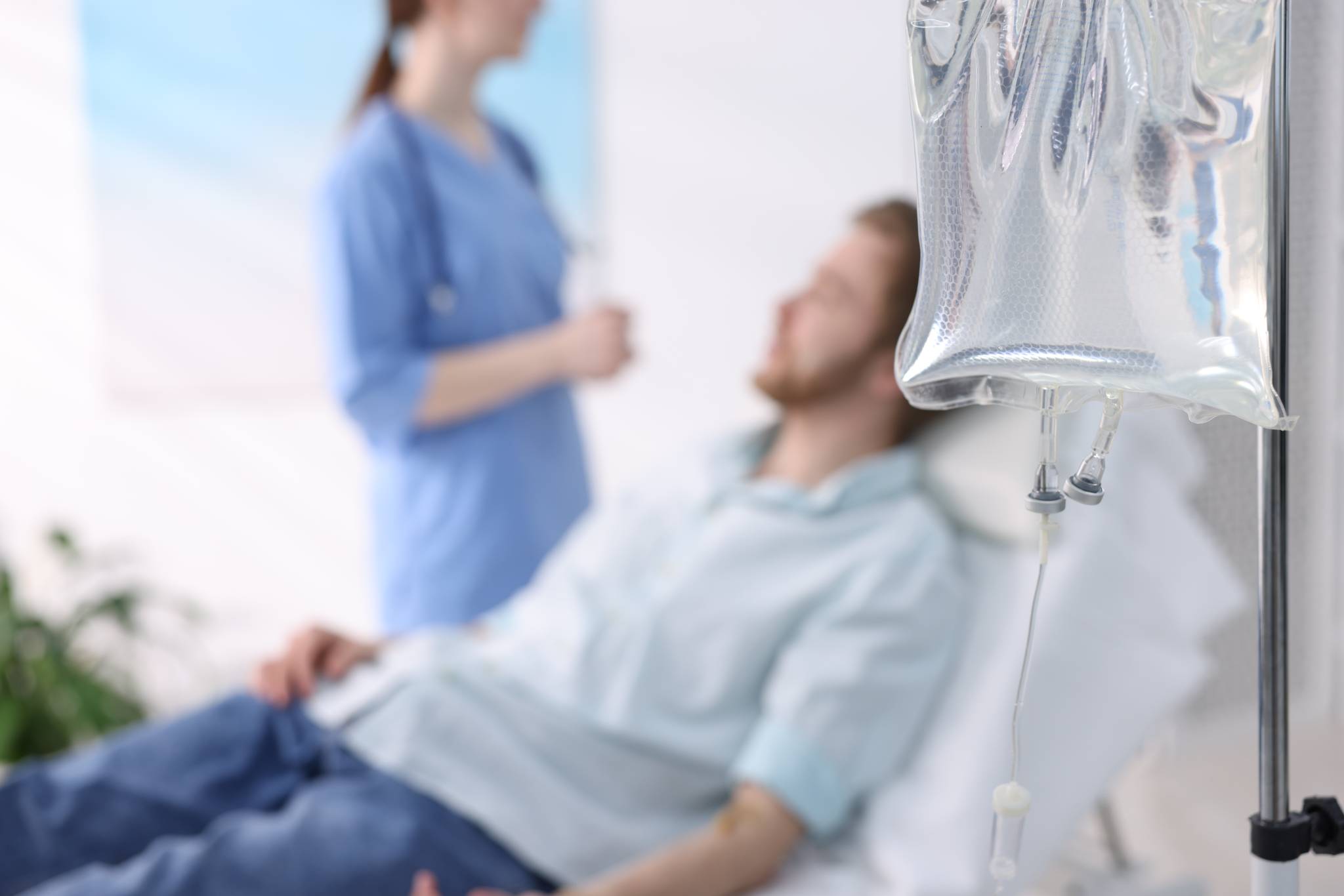 nurse checking on patient with iv drip in hospital 2026 05 25 15 05 08 utc 1