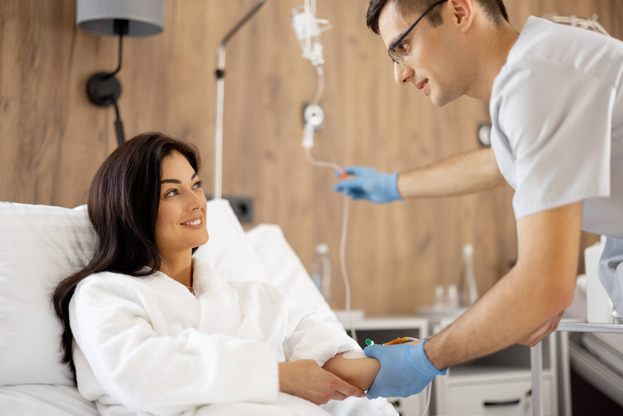 Boost Immunity & Energy: The Powerful Effects of Vitamin D IV Therapy 1 woman receiving an iv drip from a nurse 2026 03 24 01 25 54 utc 1