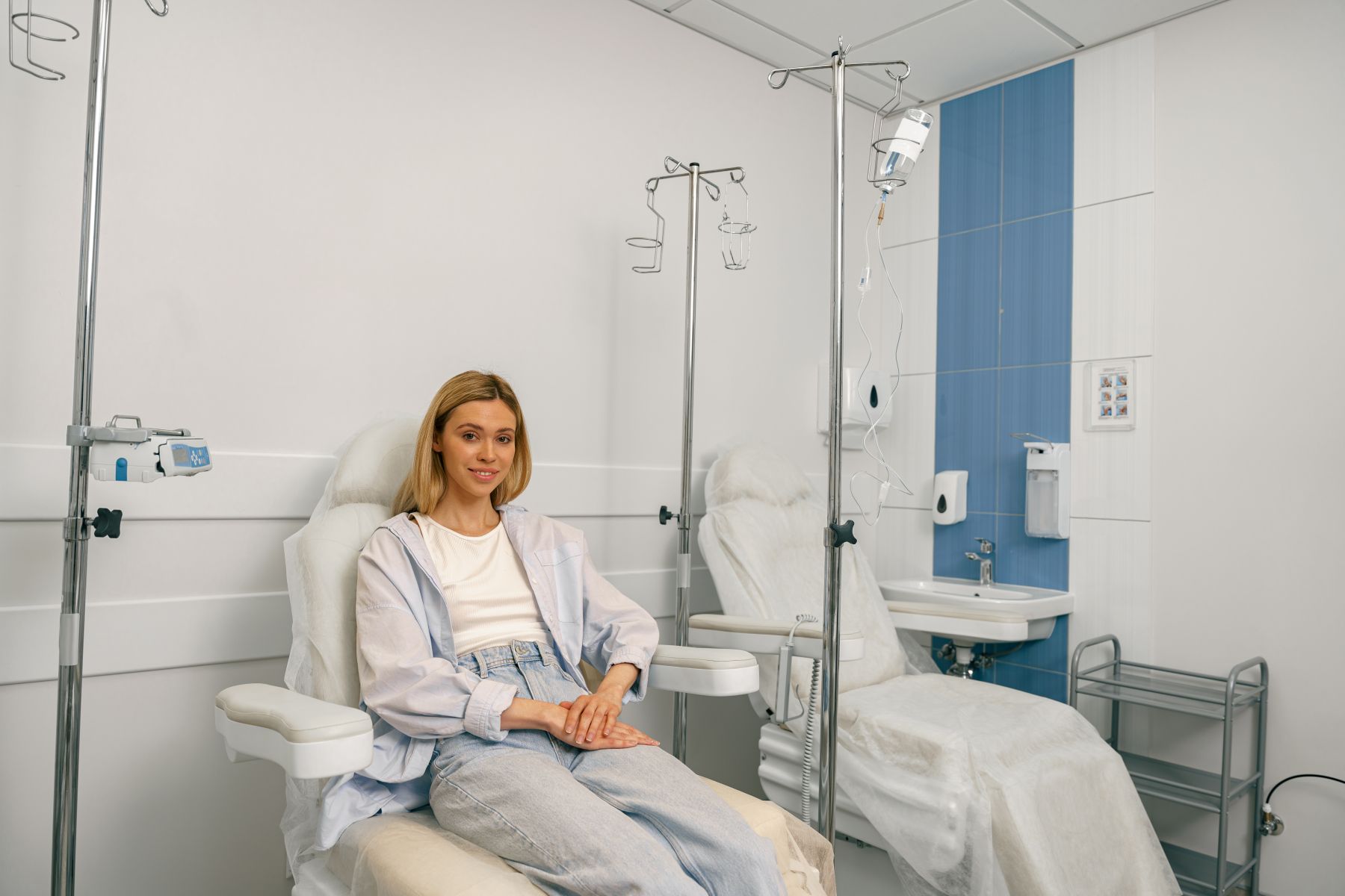 smiling woman sitting in armchair while waiting fo 2026 03 10 01 08 47 utc 1