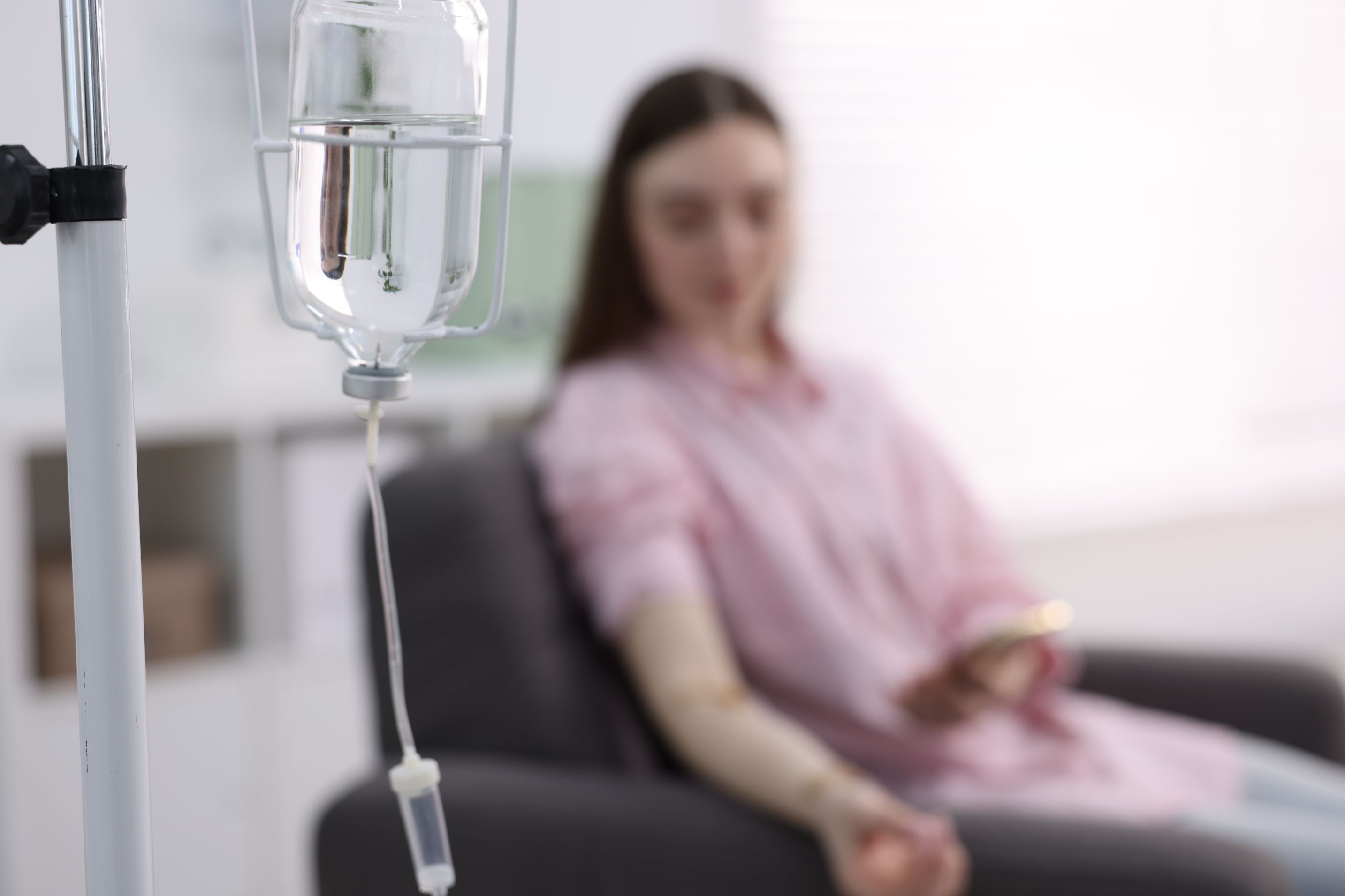 What are signs of severe dehydration? 1 woman with iv drip using smartphone in hospital s 2026 05 26 18 33 52 utc 1