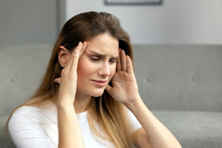 sad woman suffering from headache or migraine fee 2025 02 20 10 06 47 utc 1