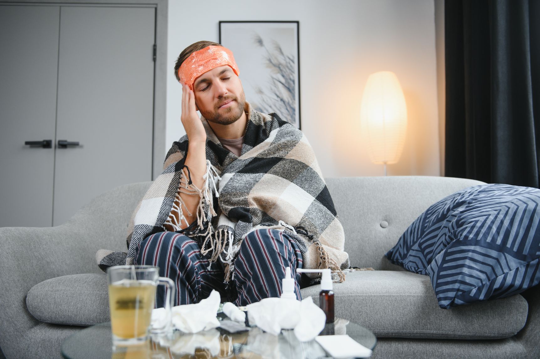 Beat the Bug in a Blitz: 3 Powerful Benefits of IV for Cold and Flu 1 young man suffering from cold at his home shot of 2025 03 14 13 38 34 utc 1