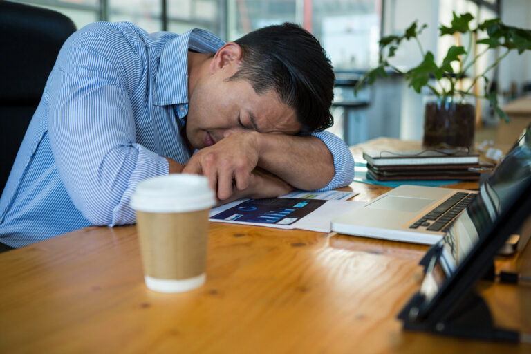 tired business executive sleeping at desk 2026 01 09 10 07 03 utc