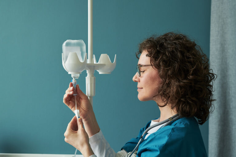 middle aged caucasian woman nurse adjusting iv dri 2026 01 09 12 04 56 utc