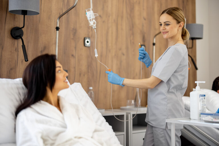 nurse prepares dropper for a young female patient 2026 01 09 00 00 06 utc