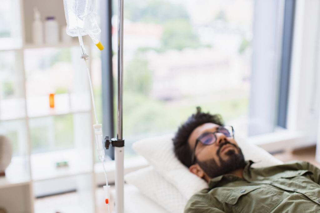 tired sick male in casual wear drips medicine intr 2026 01 07 01 45 43 utc