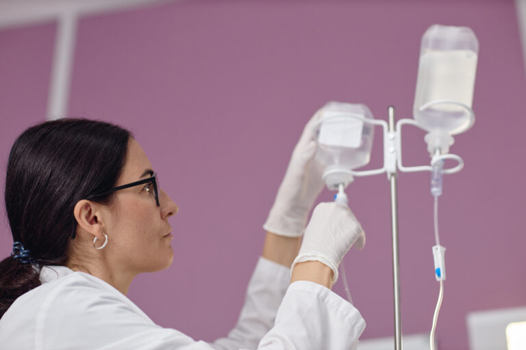 young adult woman adjusting iv drip in vascular ce 2026 01 31 01 08 27 utc