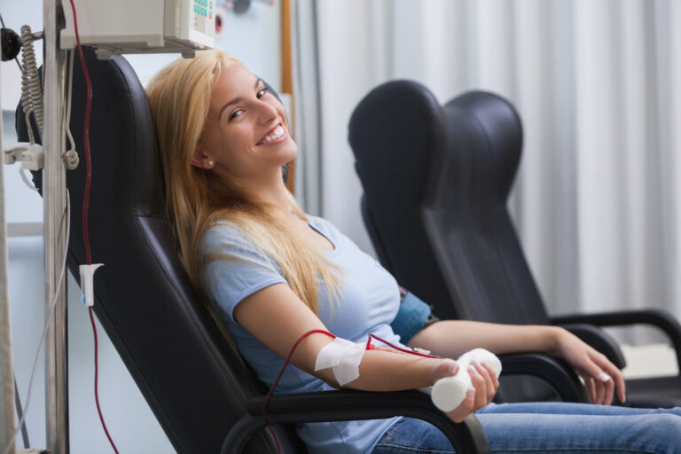 smiling woman donating blood in hospital 2026 04 14 00 30 05 utc