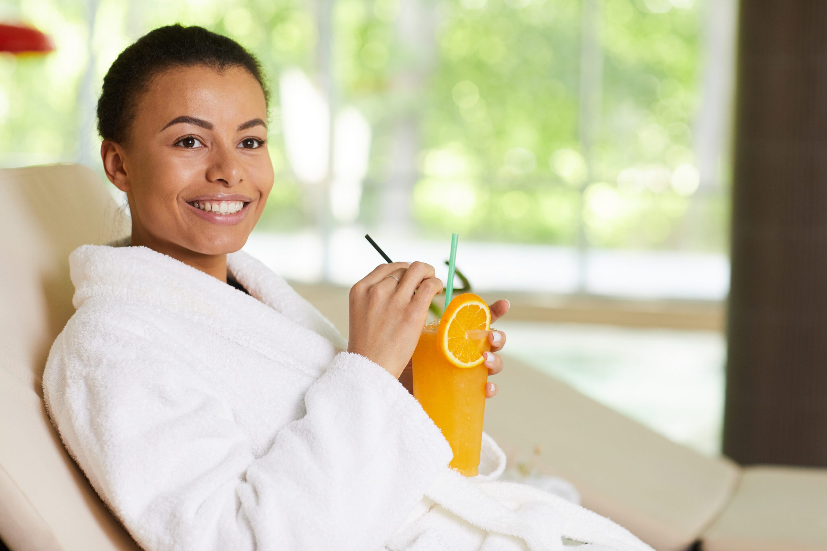 Woman drinking an orange juice